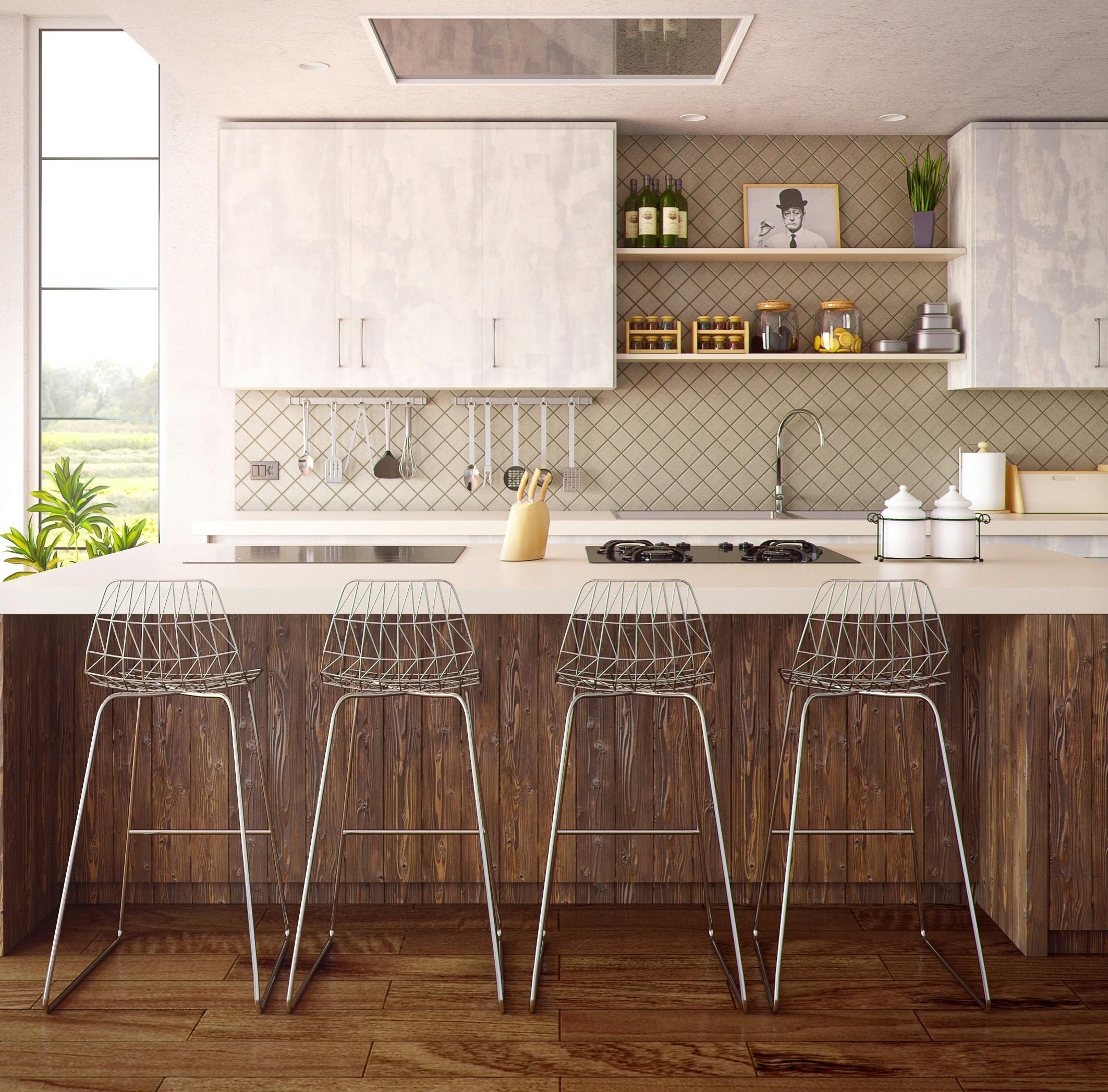 A spacious kitchen featuring a large island and a stylish bar area, perfect for cooking and entertaining guests.